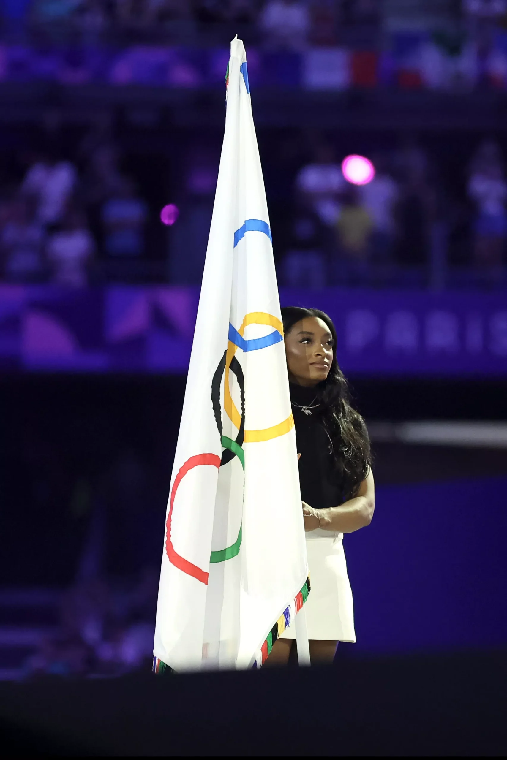 Simone Biles Carries the Olympic Flag During Paris Closing Ceremony as Olympics Transition to Los Angeles ...Full Details Bellow