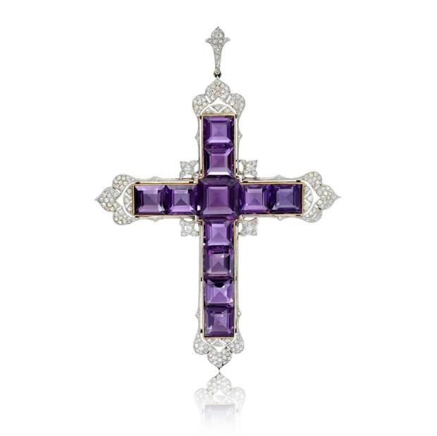 Kim Kardashian buys amethyst cross pendant worn by Princess Diana at auction...See More!!