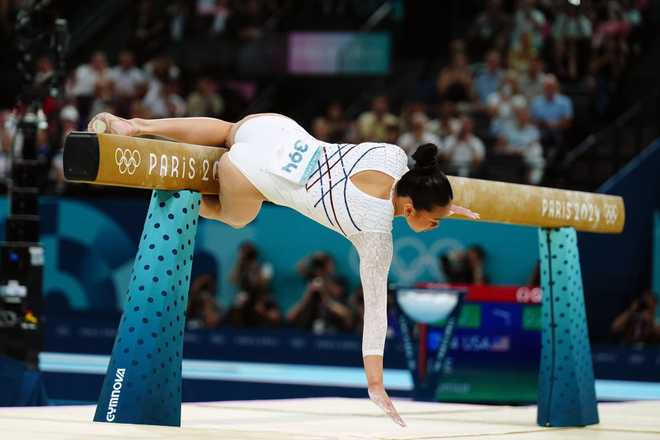 Suni Lee and Simone Biles fall off balance beam in Paris....See More